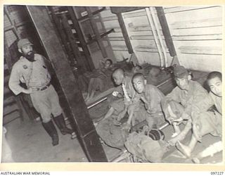 BOUGAINVILLE. 1945-09-21. JAPANESE STRETCHER CASES IN THE HOLD OF THE DEBORAH FOR EVACUATION FROM NUMA NUMA TO TOROKINA. THE EVACUATION FOLLOWED THE ARRIVAL AT NUMA NUMA PLANTATION OF MEMBERS OF ..