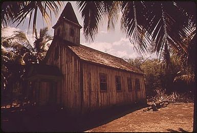 OLD CHURCH IN KEOMUKU, A "GHOST TOWN" ON THE ISLAND'S EAST SHORE, WHERE DEVELOPERS PLAN TO BUILD A HOTEL. IN A CONTROVERSIAL DECISION, THE LAND USE COMMISSION RECENTLY RECLASSIFIED THOUSANDS OF ACRES ON THIS PREDOMINANTLY AGRICULTURAL ISLAND FOR URBAN USE THE DECISION IS BEING CONTESTED IN THE COURTS