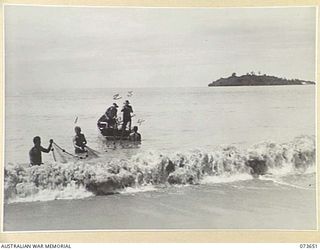 SALAMAUA, NEW GUINEA. 1944-06-01. MEMBERS OF THE 2ND MARINE FOOD SUPPLY PLATOON PULL A NET BACK THROUGH SURF ON TO A DINGHY AT SALUS LAKE. IDENTIFIED PERSONNEL ARE:- VX90299 PRIVATE D D THOMPSON ..