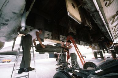 Personnel of the 43rd Munitions Maintenance Squadron prepare to load a Mark 82 500-pound high-drag bomb aboard a B-52G Stratofortress aircraft of the 60th Bomber Squadron during Exercise HARVEST COCONUT