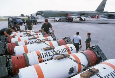 Members of the 43rd Munitions Maintenance Squadron prepare to load Mark 52 training mines onto a 43rd Strategic Wng B-52G Stratofortress aircraft during Exercise TEAM SPIRIT '85