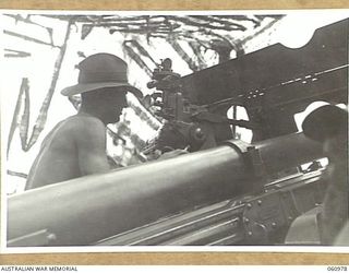 DONADABU AREA, NEW GUINEA. 1943-12-01. VX20356 LANCE BOMBARDIER J. F. P. DAWDEN, GUNLAYER OF NO. 4 GUN, A TROOP, NO. 7 BATTERY, 2/4TH AUSTRALIAN FIELD REGIMENT