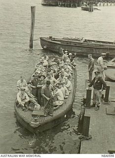 Cairns, Qld. 1944-09-27. Passengers, principally American servicemen who left Brisbane in the morning and were at Port Moresby for the evening meal, come ashore in the launch for lunch. They are ..