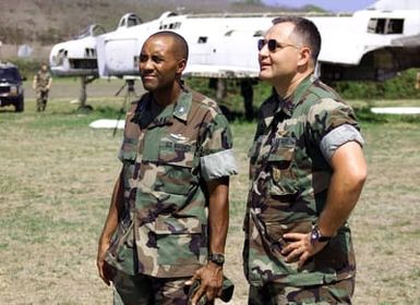 US Marine Colonel Adams, Commanding Officer of Combat Service Support Group 3, and US Navy CHIEF Hospital Man Dubois, discuss the performance of the Sailors and Marines (Not shown) during an evacuation exercise. The exercise was conducted at Marine Corps Base (MCBH), Kaneohe Bay, Hawaii