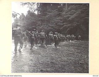YARA RIVER, NEW BRITAIN, 1945-05-10. TROOPS OF A COMPANY, 37/52 INFANTRY BATTALION, CROSSING THE YARA RIVER AT THE COMMENCEMENT OF THEIR TREK FROM RILE TO MAVELU, OPEN BAY