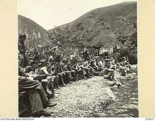 ZENAG, NEW GUINEA, 1944-02-27. AUDIENCE WATCHING A DIVING COMPETITION DURING A SPORTS CARNIVAL IN A CREEK DAMMED BY MEMBERS OF THE 2/9TH FIELD COMPANY, ROYAL AUSTRALIAN ENGINEERS. THE CARNIVAL, ..