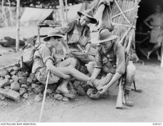 PAPUA, NEW GUINEA. 1942-08. THREE MEMBERS OF THE 39TH AUSTRALIAN INFANTRY BATTALION WHO WERE IN ACTION AGAINST THE JAPS IN THE KOKODA AREA, AND WHO HAVE BEEN SENT BACK WITH BULLET WOUNDS, ..