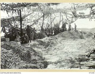 PORT MORESBY, NEW GUINEA. 1944-04-15. PERSONNEL FROM THE 8TH ARMY TROOPS COMPANY, ROYAL AUSTRALIAN ENGINEERS PICTURED DURING A REST PERIOD DURING CONSTRUCTION OF THE BASILISK BATTERY. THE BATTERY ..