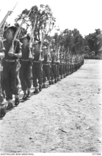 TOROKINA, BOUGAINVILLE ISLAND. 1944-12-06. PERSONNEL OF THE 15TH INFANTRY BATTALION MARCHING OFF THE PARADE GROUND AFTER AN INSPECTION BY THE GENERAL OFFICER COMMANDING, 3RD DIVISION. IDENTIFIED ..