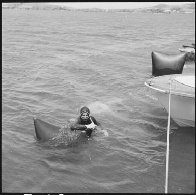 Man in scuba gear holding onto a float, Isle of Pines, New Caledonia, 1967 / Michael Terry