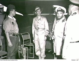 THE SOLOMON ISLANDS, 1945-08-20. ON HMAS LITHGOW OFF MOILA POINT AUSTRALIAN NAVY AND ARMY OFFICERS DISCUSS FURTHER STEPS IN THE PRE- SURRENDER ARRANGEMENTS WITH JAPANESE OFFICERS. (RNZAF OFFICIAL ..