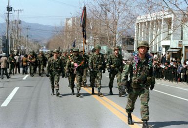 Members of the 25th Infantry Division from Schofield Barracks, Hawaii, march in a parade during their deployment to participate in the joint Republic of Korea/U.S. training exercise Team Spirit '82