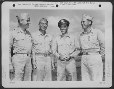 Colonel Lewis M. Sanders Of Chicago, Illinois, Commanding Officer Of The 318Th Fighter Group, Poses With His Superiors After Receiving The Legion Of Merit From Brig. General Thomas J. Cushman, Usmc, Commanding General Of The Saipan Air Defense Command, At (U.S. Air Force Number 3A49058)