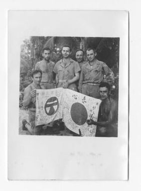 [U.S. Soldiers Hold up Japanese Good Luck Flags]