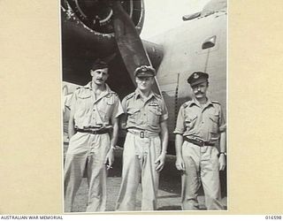 1944-02-24. NEW GUINEA. SHOWN: F/LT T. CALDER OF BRISBANE, Q'LD, F/LT R. OVERHEU DFC, OF WEST BROOKTON, W.A., F/LT. J. NAPIER, OF ADELAIDE S.A