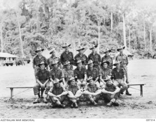 Group portrait of members of 4 Platoon, Headquarters Company, 58/59 Infantry Battalion. Identified, back row, left to right: Private (Pte) L Morris; Pte W Webb; Pte D Bell; Pte C Gray; Pte P ..