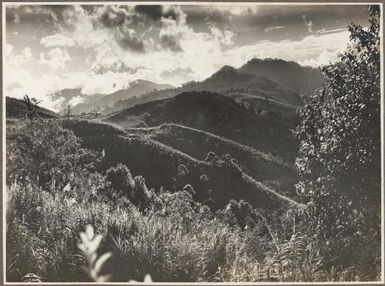 Looking back to Mount Tafa from Ononge, [1] Frank Hurley