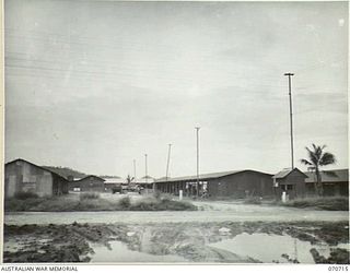 PORT MORESBY, PAPUA, NEW GUINEA, 1944-03-01. A GENERAL VIEW OF THE 4 MILE DETAILS ISSUING DEPOT OF THE 183RD SUPPLY DEPOT PLATOON, SHOWING THE ENTRANCE FROM THE MAIN ROAD