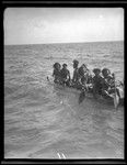 Group of men on canoe, coming from Anuta to greet visitors