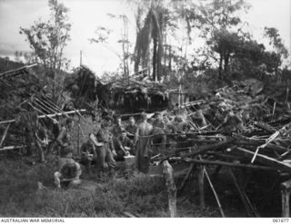 WAREO, NEW GUINEA. 1943-12. TROOPS OF THE 2/23RD AUSTRALIAN INFANTRY BATTALION, ATTENDING SICK PARADE AT THE NEWLY ESTABLISHED REGIMENTAL AID POST. IDENTIFIED PERSONNEL ARE: VX36836 PRIVATE J. A. ..