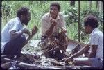 Western Highlands: men eating pork