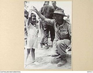 RABAUL, NEW BRITAIN. 1945-10-10. A SPECIAL PARADE AND CONCERT WAS HELD AT THE CAMP TO CELEBRATE THE 34TH ANNIVERSARY OF THE FOUNDING OF THE CHINESE REPUBLIC. MAJOR GENERAL K.W. EATHER, GENERAL ..