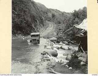 WAU - LAE ROAD, NEW GUINEA, 1944-02-27. ONE OF THE MANY FORDS ON THE ROAD TAKEN AT A POINT 47 MILES FROM WAU