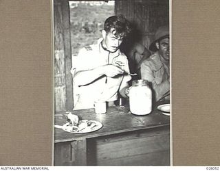 PAPUA, NEW GUINEA. 1942-07-27. SQUADRON LEADER P.J. TURNBULL, DFC., COMMANDING OFFICER OF NO. 76 SQUADRON, ROYAL AUSTRALIAN AIR FORCE, LEADER OF A PARTY OF PILOTS WHO HAVE RECENTLY ARRIVED IN THE ..