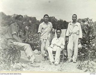 LAE, NEW GUINEA. 1944-12-30. SENIOR REPRESENTATIVE WYSHAM, AUSTRALIAN RED CROSS SOCIETY (1) CHATTING WITH JAPANESE PRISONERS OF WAR CONVALESCING AT THE 2/7TH AUSTRALIAN GENERAL HOSPITAL. SEEN ARE:- ..