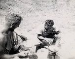 Bud Boisen and John Gunderson cooking on Guadalcanal, 1940s