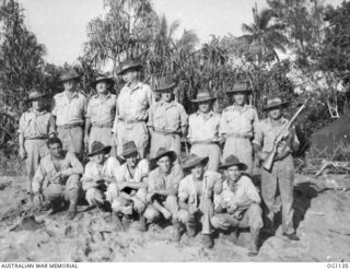 AITAPE, NORTH EAST NEW GUINEA. C. 1944-06. GROUP PORTRAIT OF MEMBERS OF NO. 13 SURVEY UNIT RAAF WHO LANDED WITH THE FIRST WAVES AND WHO SET OUT BIVOUAC AREAS IN THE AITAPE AREA. AMONG THEM ARE: ..