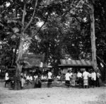 Members of Piula Club in their uniform lavalava gathered with others