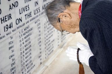 Zenji Abe, a Japanese aviator in the second wave of dive-bombers during the attack on Pearl Harbor offers a blessing of peace on the USS ARIZONA Memorial at Pearl Harbor, Hawaii, on Dec. 7, 2006. (U.S. Navy PHOTO by Mass Communication SPECIALIST 2nd Class Ben A. Gonzales) (Released)