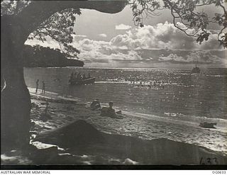 KIRIWINA, TROBRIAND ISLANDS, PAPUA. 1944-01-31. BEACH SCENE AT THE RAAF BATTLE STATION WHERE THE MEN FIND THEIR ONLY RESPITE FROM THE GRIME OF BATTLE IN SWIMMING AND BOATING