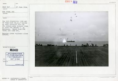 The USS Corregidor Throws Up Anti-Aircraft Fire as Japanese Planes Make Torpedo Runs at Dusk, off Saipan Island in Marianas