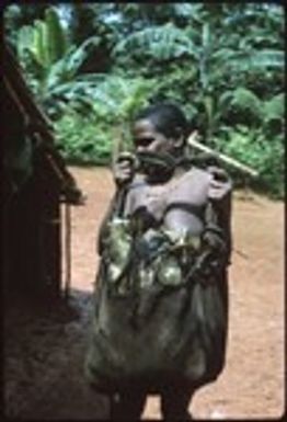 Woman with bag full of fish packets, brought up from the coast