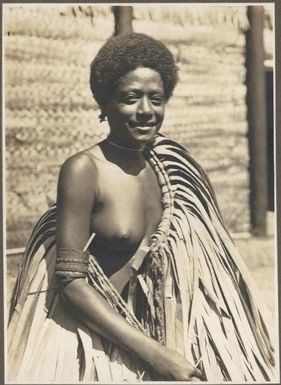 A Boanai beauty, North Coast [wearing a grass skirt over her shoulder] Frank Hurley