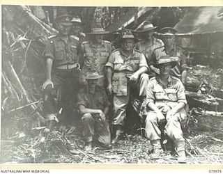 TOKO, BOUGAINVILLE, SOLOMON ISLAND. 1945-03-26. VX1 GENERAL SIR THOMAS BLAMEY, COMMANDER- IN- CHIEF, ALLIED LAND FORCES, SOUTH WEST PACIFIC AREA (THIRD FROM RIGHT), AMONG SENIOR OFFICERS OF ..