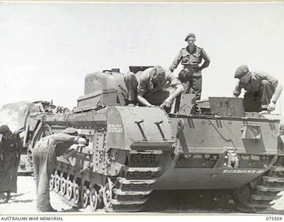 MADANG, NEW GUINEA. 1944-08-23. THE CREW OF A CHURCHILL IV TANK DOING A MAINTENANCE CHECK ON THE WHARF AFTER IT HAD BEEN UNLOADED FROM THE AMERICAN LIBERTY SHIP, NORMAN J. COLMAN. THIS VESSEL ..