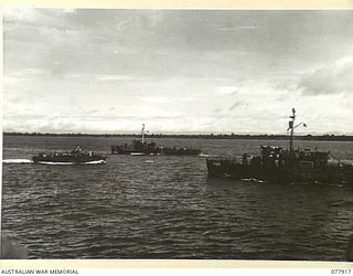 PURIATA RIVER AREA, BOUGAINVILLE ISLAND. 1944-12-31. TWO LANDING CRAFT INFANTRY GUNBOATS AND A PT BOAT REGAINING FORMATION AFTER SHELLING ENEMY INSTALLATIONS IN THE TOKO RIVER SECTOR DURING A JOINT ..