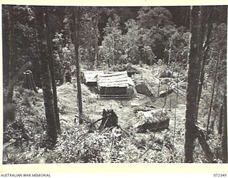 EORA CREEK, NEW GUINEA. 1944-04-09. THE EORA CREEK SIGNAL STATION, OPERATED BY THE 23RD LINE SECTION, 18TH LINES OF COMMUNICATION SIGNALS. THE STATION WAS PHOTOGRAPHED AT THE DIRECTION OF VX76415 ..