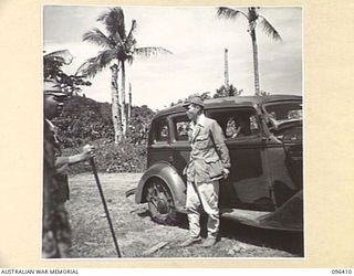 KAIRIRU ISLAND, NEW GUINEA, 1945-09-11. COLONEL MARUYAMA, JAPANESE MEDICAL OFFICER (NAVY), PERSONAL PHYSICIAN TO REAR-ADMIRAL SATO, ALIGHTING FROM HIS CAR DURING THE TRANSFER OF AN ADVANCE PARTY OF ..