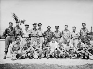 Wunung Plantation, Jacquinot Bay, New Britain,1945-03-02.  Administration personnel of the 105th Casualty Clearing Station.
Back Row: 
1. VX60749 Craftsman  Alan David Regan; 2. NX119600 (N195105) ..