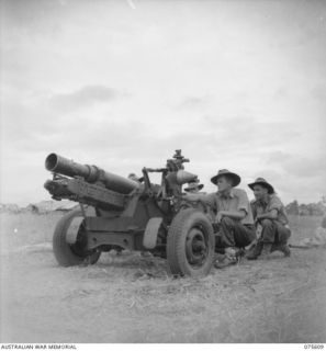 MARKHAM VALLEY, NEW GUINEA. 1944-08-28. THE CREW OF A SHORT 25 POUNDER GUN FROM 12 BATTERY TAKE UP THEIR POSITIONS ON THE RANGE OF THE 4TH FIELD REGIMENT. IDENTIFIED PERSONNEL ARE: VX83163 SERGEANT ..