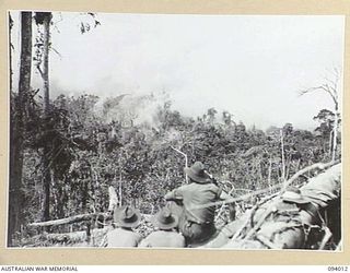 WEWAK AREA, NEW GUINEA, 1945-07-14. 2/1 FIELD REGIMENT AND 2/3 FIELD REGIMENT, FIRED 4,500 25-POUNDER SHELLS OVER A PERIOD OF 45 MINUTES. THIS WAS FOLLOWED BY 350 3-INCH MORTAR BOMBS AND 500 ROUNDS ..