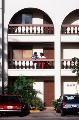 A1C Paula Heath and her husband, SRA Mike Heath, relax on the balcony of their apartment complex near Andersen Air Force Base