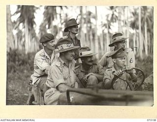 ALEXISHAFEN, NEW GUINEA. 1944-05-12. SENIOR ARMY OFFICERS AT ALEXISHAFEN NO.1 AIRSTRIP DURING A RECONNAISSANCE OF THE AREA. THEY ARE BEING DRIVEN BY QX52590 DRIVER C. NIELSON (6), FROM HEADQUARTERS ..