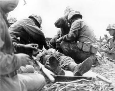 [Marine on Namur Island Receiving First Aid]
