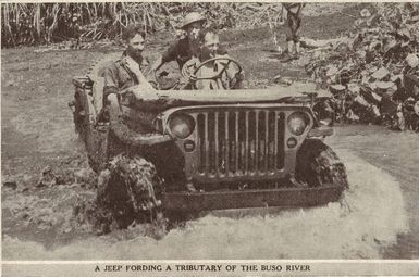 A jeep fording a tributary of the Buso River