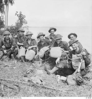 1942-12-14. PAPUA - GONA. AUSTRALIANS CAPTURED THE EASTERN PART OF GONA VILLAGE. WHEN THE AUSTRALIANS ATTACKED, SOME OF THE JAPANESE SWAM OUT TO SEA. THEY ALL WORE KAPOK LIFE JACKETS. DIGGERS HOLD ..